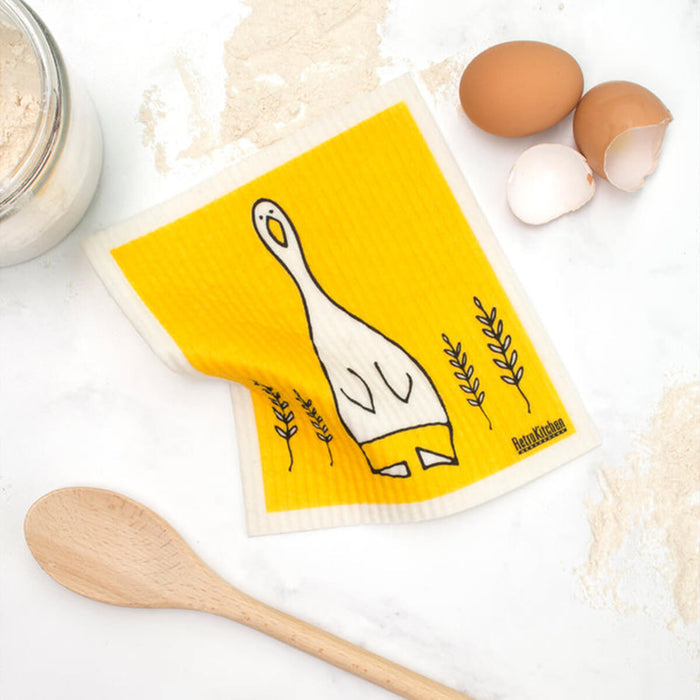 Compostable sponge cloth with a duck design on a bench.
