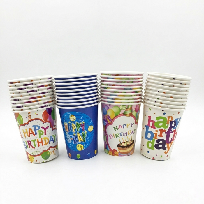 Set of colorful paper cups with 'Happy Birthday' text on a white background