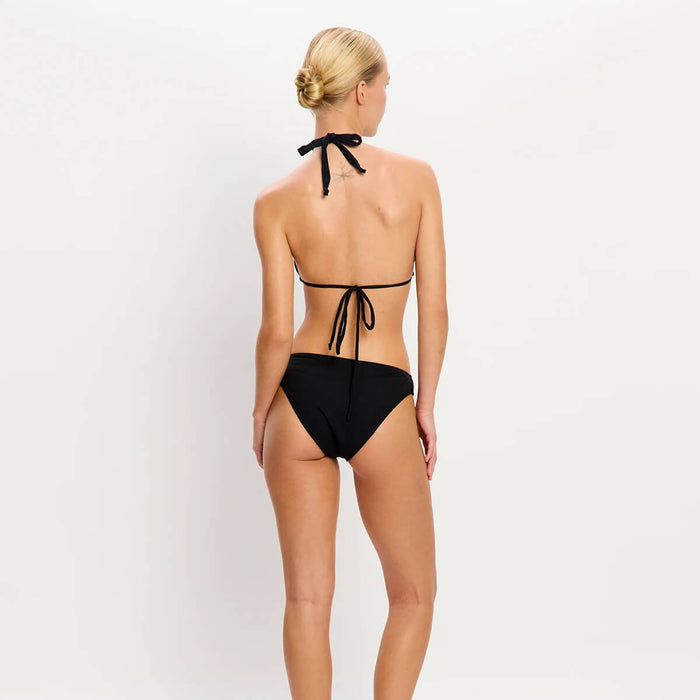 Back view of model wearing Modibodi Swimwear Bikini Brief in black with light to moderate absorbency, period swimwear made with sustainable materials.