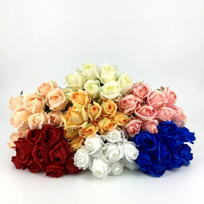 Bouquet of artificial roses in various colors on a white background