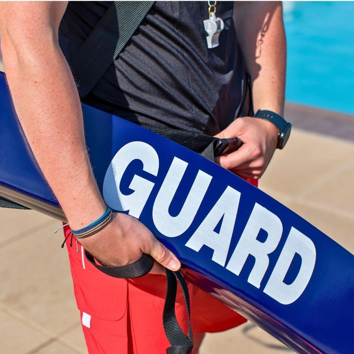 The Lifeguard Store 50" blue vinyl rescue tube with white "GUARD" lettering, featuring a NBR foam core and heavy-duty towline.