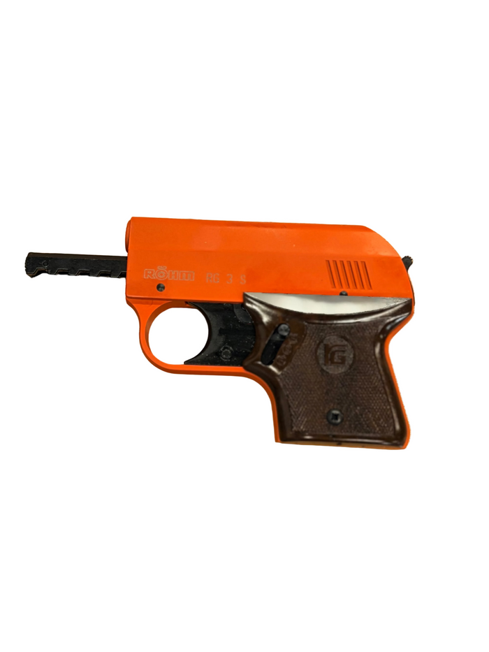 Orange and black Rohm blank firing pistol on a white background