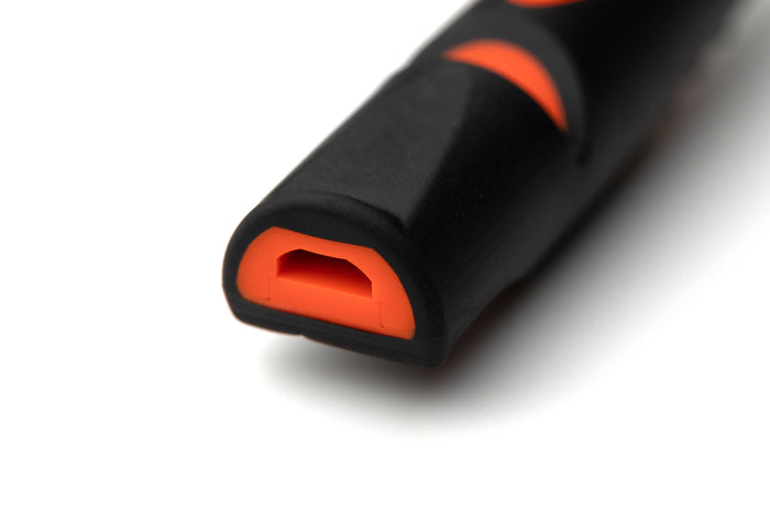 A black and orange Acme 211.5 dog whistle
