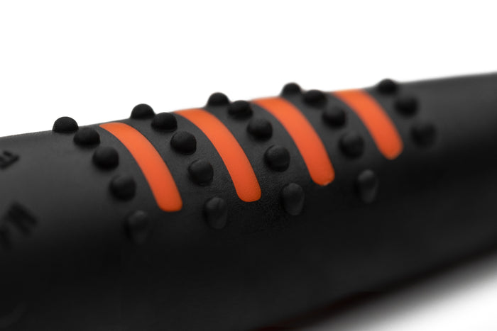 A black and orange Acme whistle for sale at Muntjac Trading