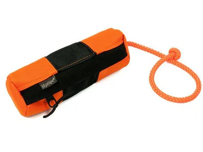Orange and black treat dummy with a rope on a white background