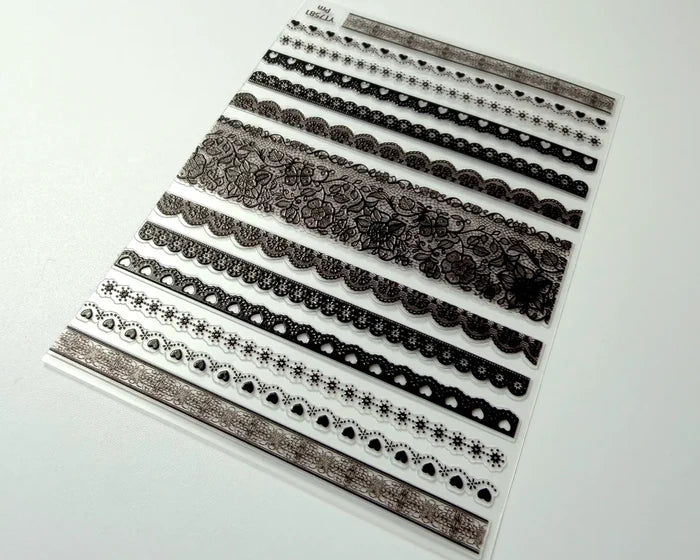 Black Lace Love nail art decals, angled close-up