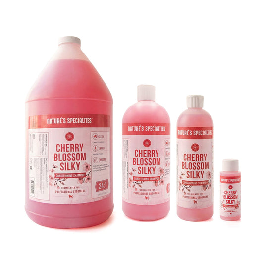 Set of 'Cherry Blossom Silky' shampoo bottles from Nature's Specialties on a white background