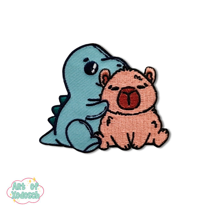 dino with capybara iron-on patch