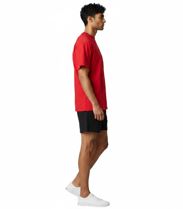 The Lifeguard Store red Dri-Fit short sleeve lifeguard t-shirt worn by a man in profile view