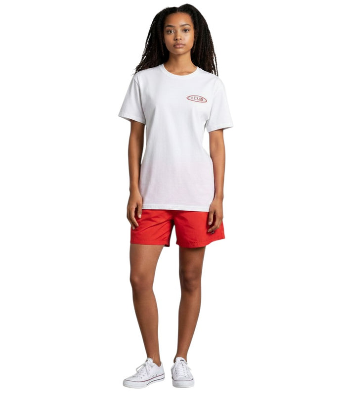 The Lifeguard Store white Dri-Fit short sleeve guard t-shirt worn by a woman with red shorts and white sneakers