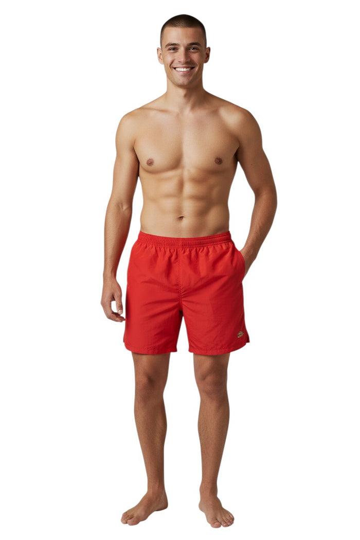 The Lifeguard Store Kiefer 4-Way Unisex Deck Short in solid red. Features elastic waist, drawstring, side pockets, and back velcro pocket.