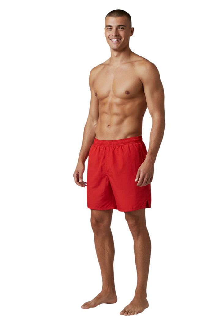 The Lifeguard Store Kiefer 4-Way Unisex Deck Short in solid red. Features elastic waist, drawstring, side pockets, and a back pocket with velcro.