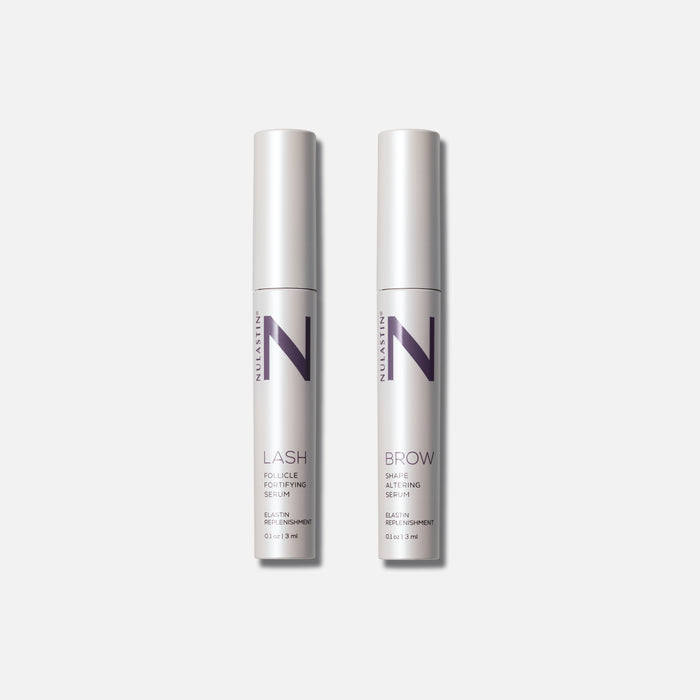 Front view of Lash and Brow Dual System two 0.13 fl oz (3 ml) serum tubes showing NULASTIN packaging on light gray background
