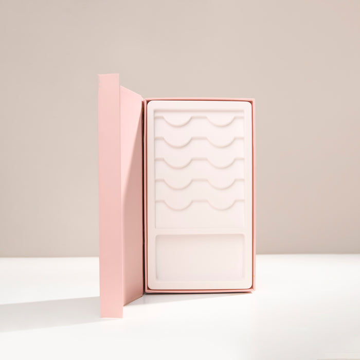An opened Lash Story Visionary - perfect for 5 lashes, glue, and tweezers.