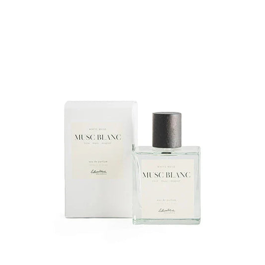 A bottle of Lothantique Eau de Parfum White Musk with the cap off, next to its white box packaging labeled with the product name and brand.