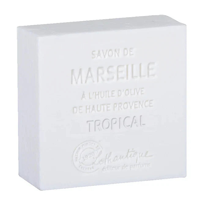 A white rectangular bar of Marseille soap with embossed text reading 'SAVON DE MARSEILLE', 'A L'HUILE D'OLIVE DE HAUTE PROVENCE', and 'TROPICAL', plus a faint brand mark near the bottom, shown on a white background.
