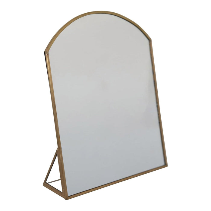 Mirror with gold frame on a white background