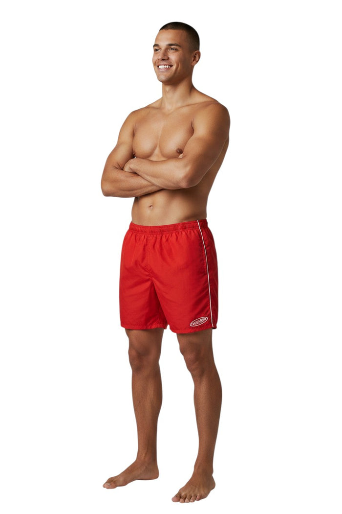 The Lifeguard Store red nylon lifeguard trunks with elastic waistband, drawstring, side pockets, and GUARD logo. 5" inseam.
