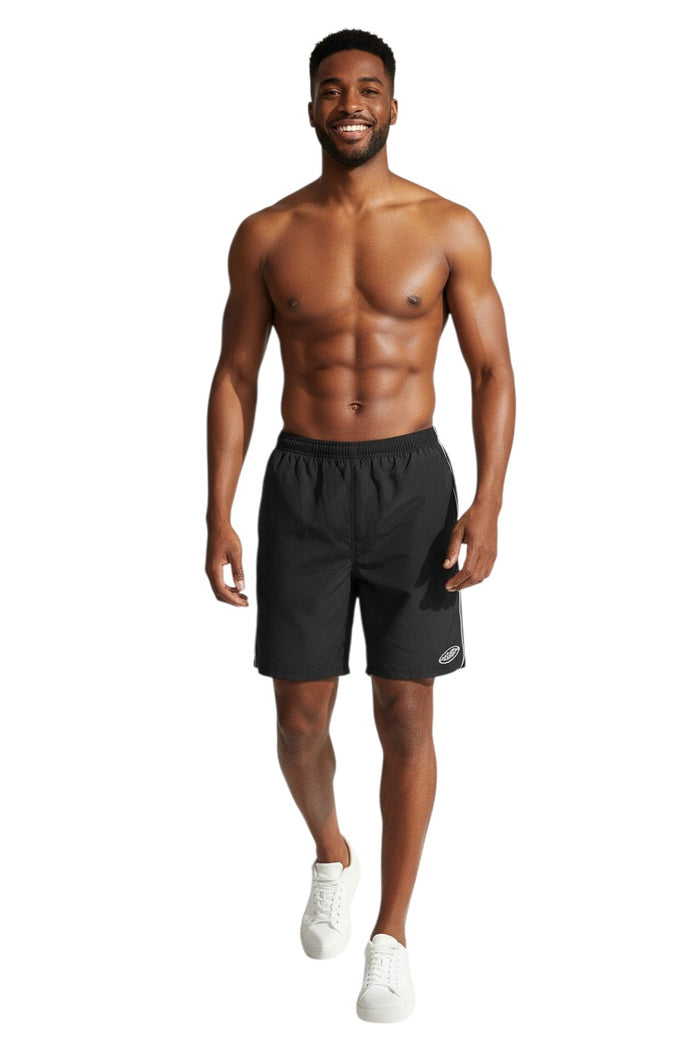 The Lifeguard Store black nylon lifeguard trunks with white piping and GUARD logo on left leg. Elastic waistband and 5" inseam.