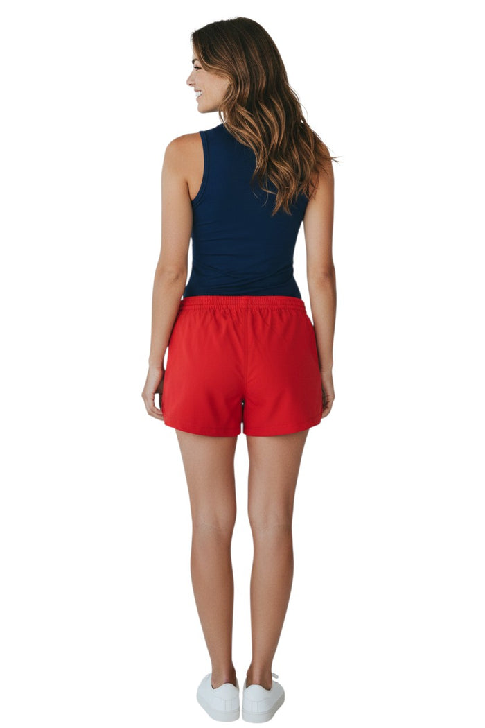 The Lifeguard Store red polyester comfy shorts with elastic waistband, drawstring, and two front pockets. UPF30+ UV protection.
