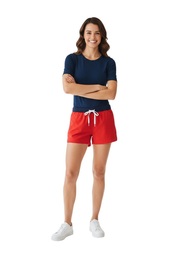 The Lifeguard Store red polyester comfy shorts with navy waistband, drawstring, and pockets. UPF30+.