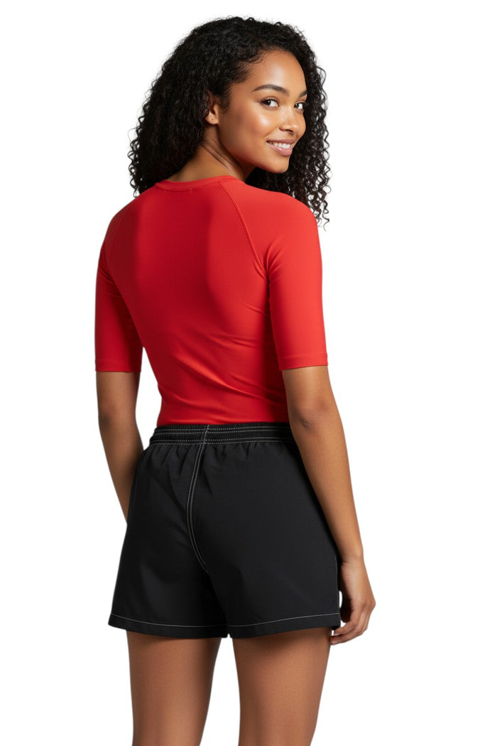 The Lifeguard Store RISE black nylon board shorts with 3" inseam, elastic waistband, drawstring, and side pocket.