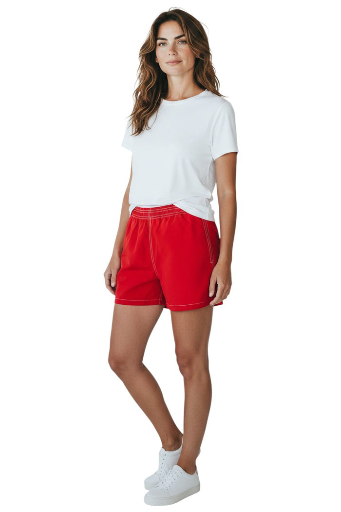 The Lifeguard Store red nylon board shorts with elastic waistband, drawstring, and side pocket. 3" inseam.