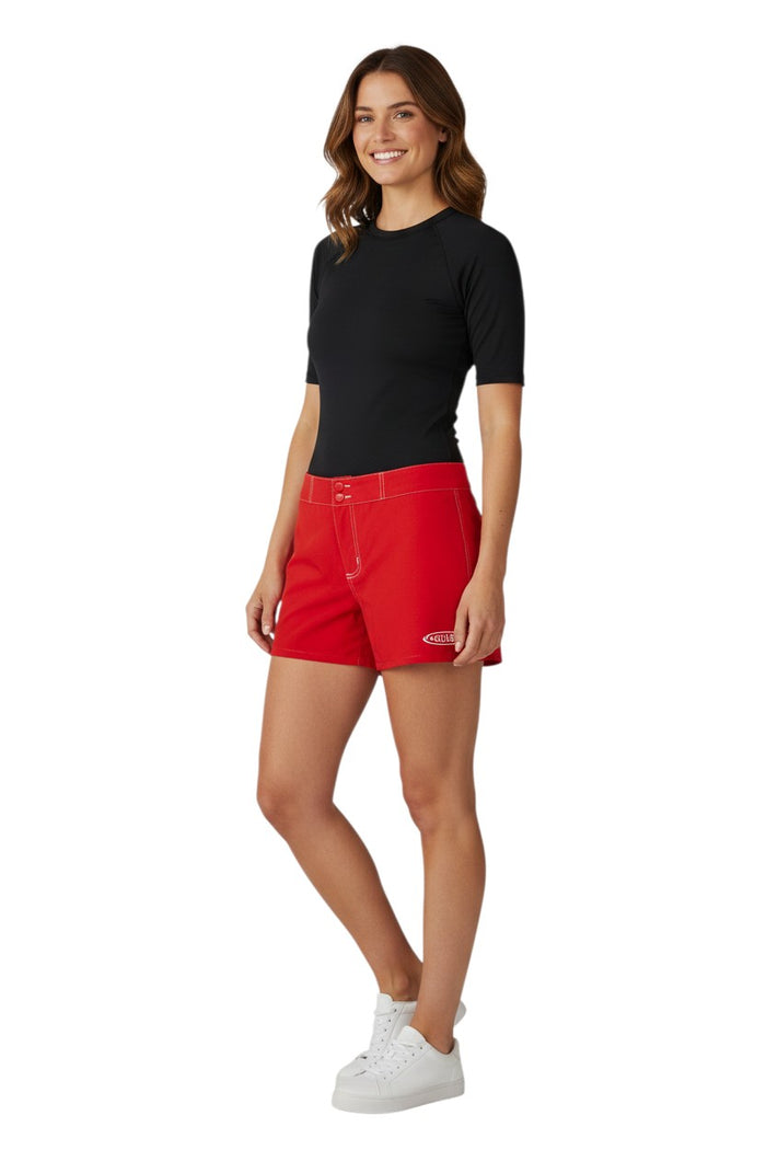 The Lifeguard Store red polyester-spandex Guard Flex shorts for women with drawstring waist and side pocket. Guard logo on left leg.
