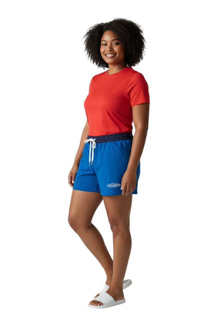 The Lifeguard Store RISE Guard Female Roll Short in royal blue polyester with elastic waistband, drawstring, and two front pockets. Features UPF 30+ protection.