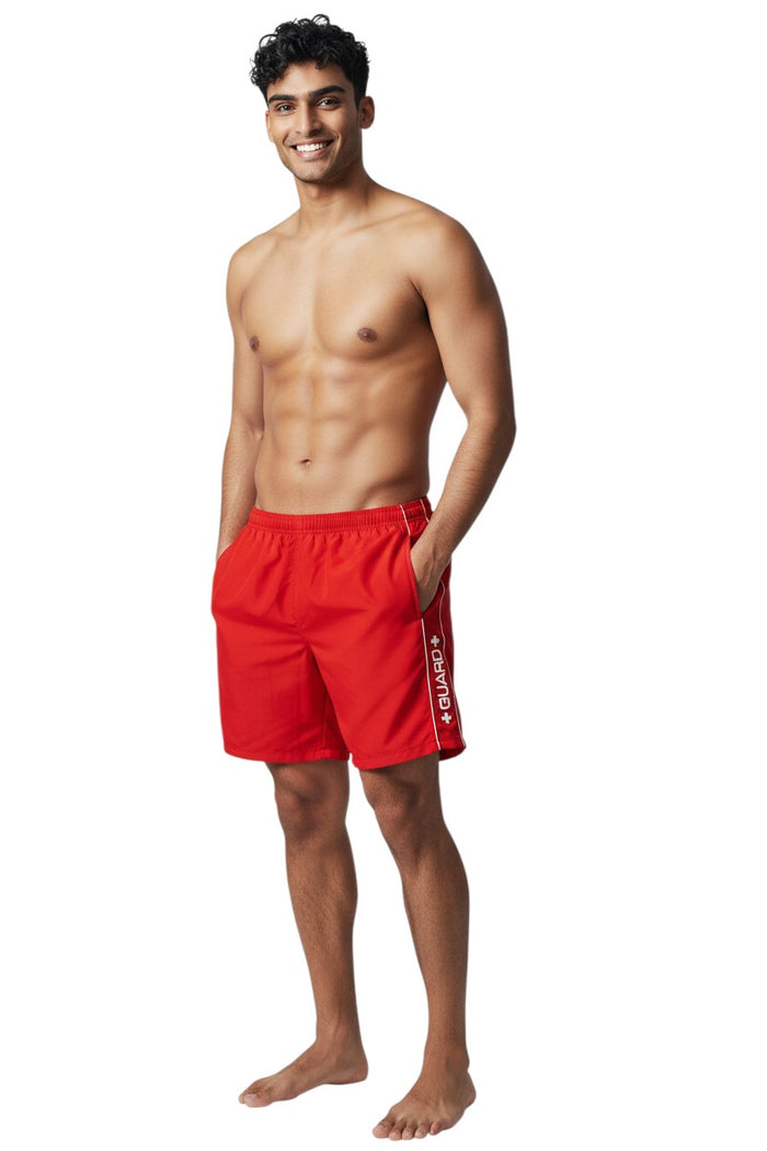 The Lifeguard Store RISE Guard Flex Short in red polyester/spandex with white piping and GUARD logo.