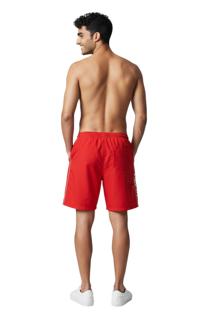 The Lifeguard Store RISE Guard Flex Short in red polyester/spandex with white piping and Guard logo.
