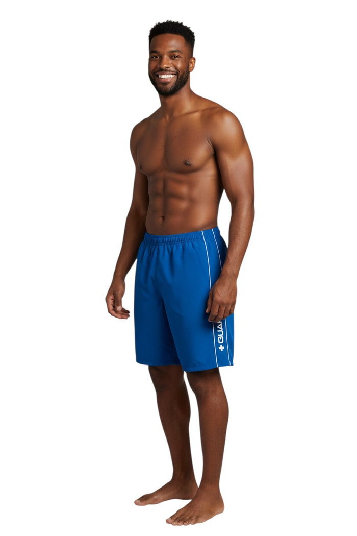 The Lifeguard Store blue polyester spandex boardshorts with white piping and GUARD logo. Elastic waistband, drawstring, and side pocket.