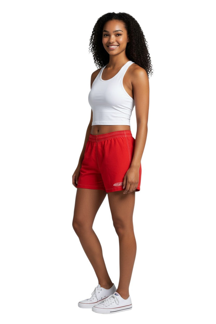 The Lifeguard Store red polyester-spandex board shorts with drawstring waist and side pocket featuring a GUARD logo.