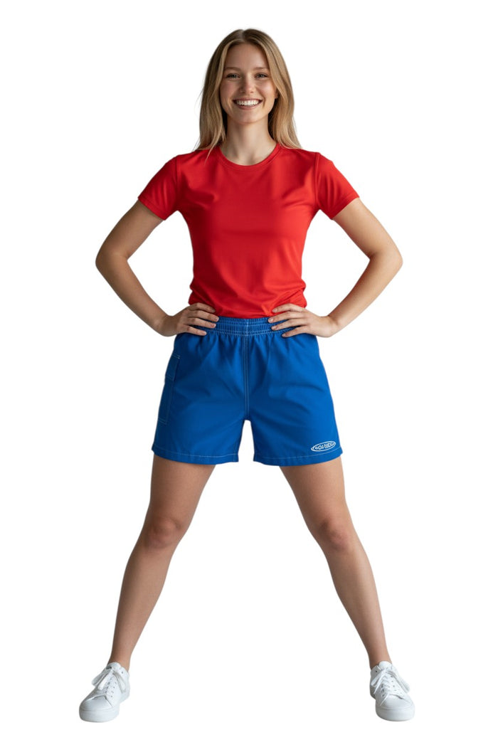 The Lifeguard Store blue polyester-spandex board shorts with elastic waistband, drawstring, side pocket, and GUARD logo.