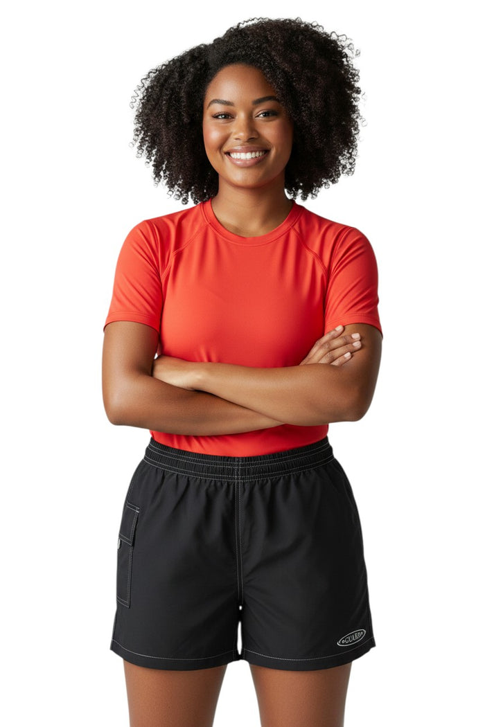 The Lifeguard Store black polyester-spandex board shorts with elastic waistband, drawstring, side pocket, and GUARD logo.