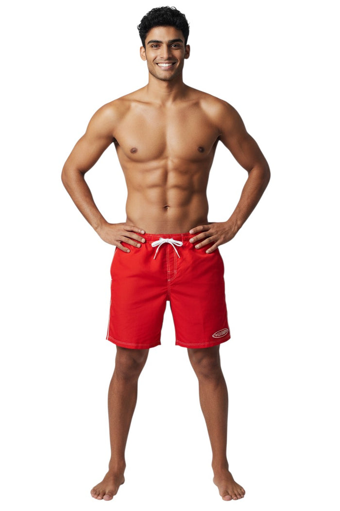 The Lifeguard Store red polyester blend boardshorts with white drawstring, contrast stitching, and GUARD logo. Elastic waistband and side pocket.