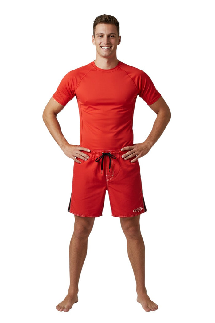 The Lifeguard Store red polyester board shorts with black side stripe and GUARD logo. Elastic waist, drawstring, and side pocket.