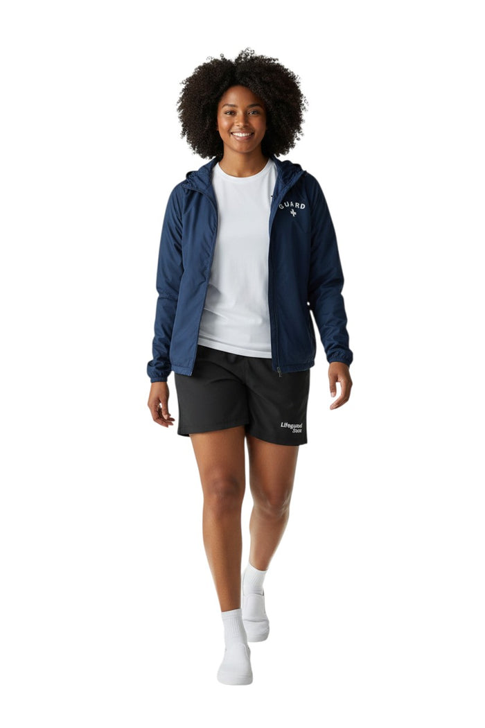 The Lifeguard Store navy blue waterproof polyurethane jacket with "GUARD" lettering and a white cross on the chest.