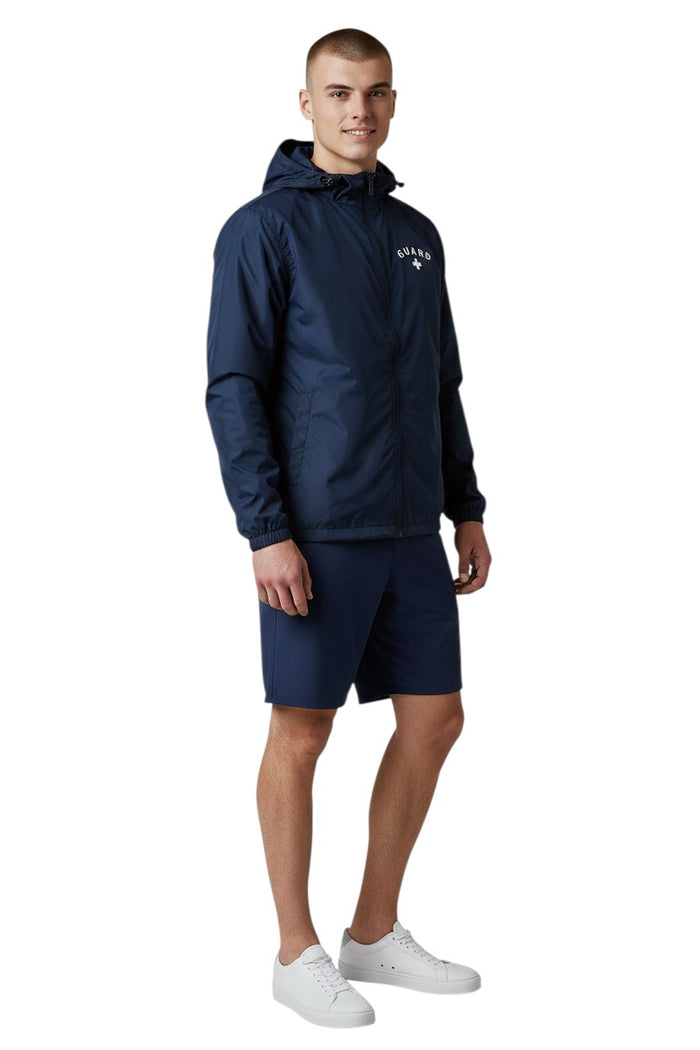 The Lifeguard Store RISE Guard navy blue waterproof polyurethane jacket with full zip and "GUARD" lettering.