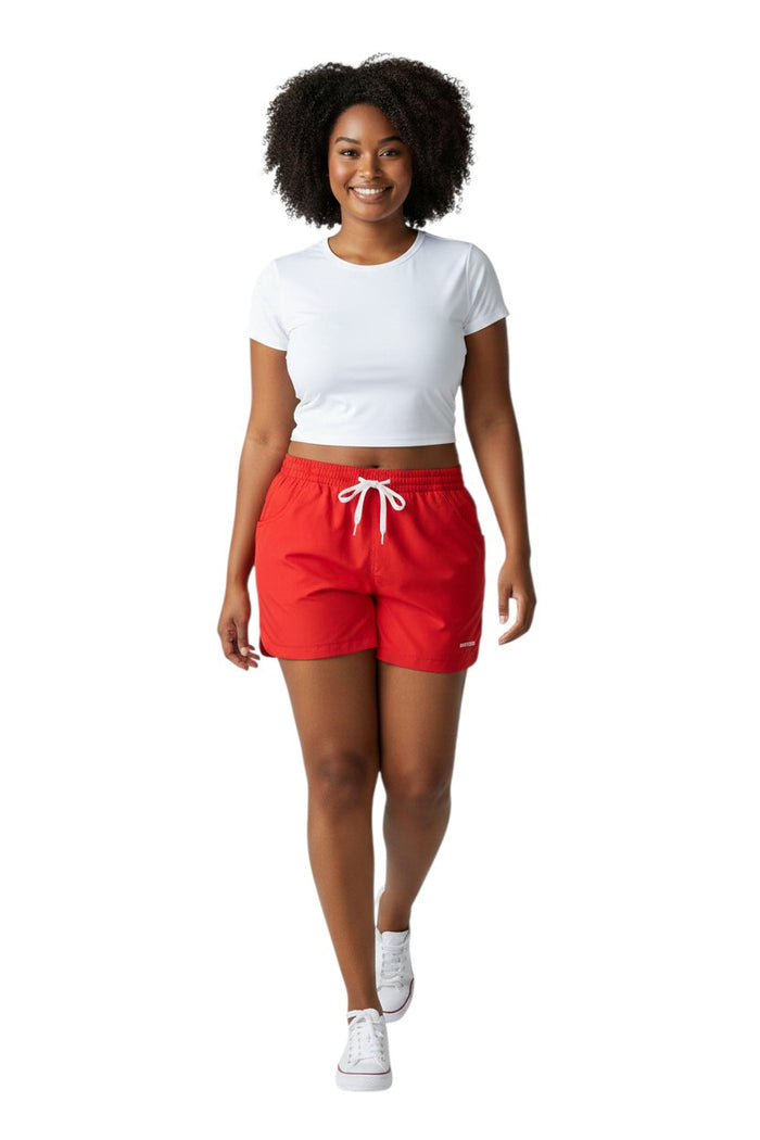 The Lifeguard Store red polyester instructor shorts with white drawstring and navy waistband. Quick-dry fabric.