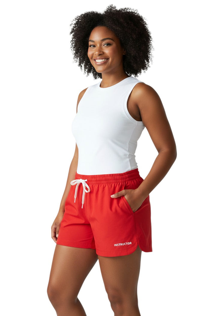 The Lifeguard Store red polyester instructor shorts with elastic waistband, drawstring, and two front pockets. UPF30+.