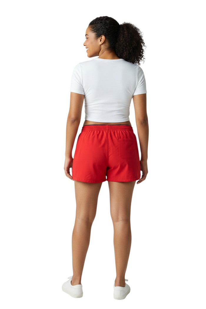 The Lifeguard Store red polyester instructor shorts with white drawstring and navy waistband. Features UPF30+ protection.