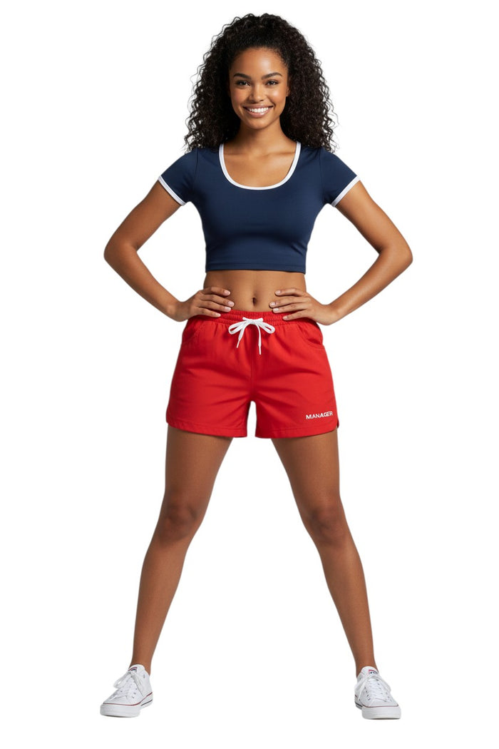 The Lifeguard Store RISE Manager red polyester roll shorts with drawstring and pockets.