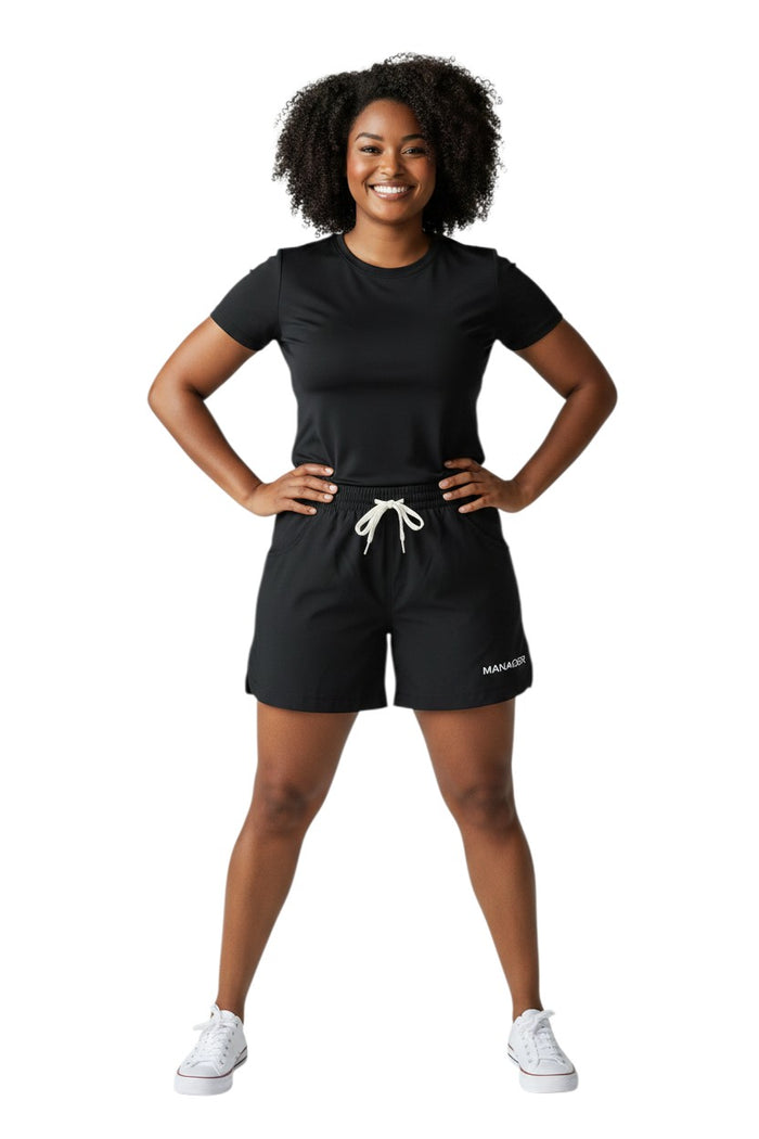 The Lifeguard Store black polyester roll shorts with elastic waistband, drawstring, and "MANAGER" text.