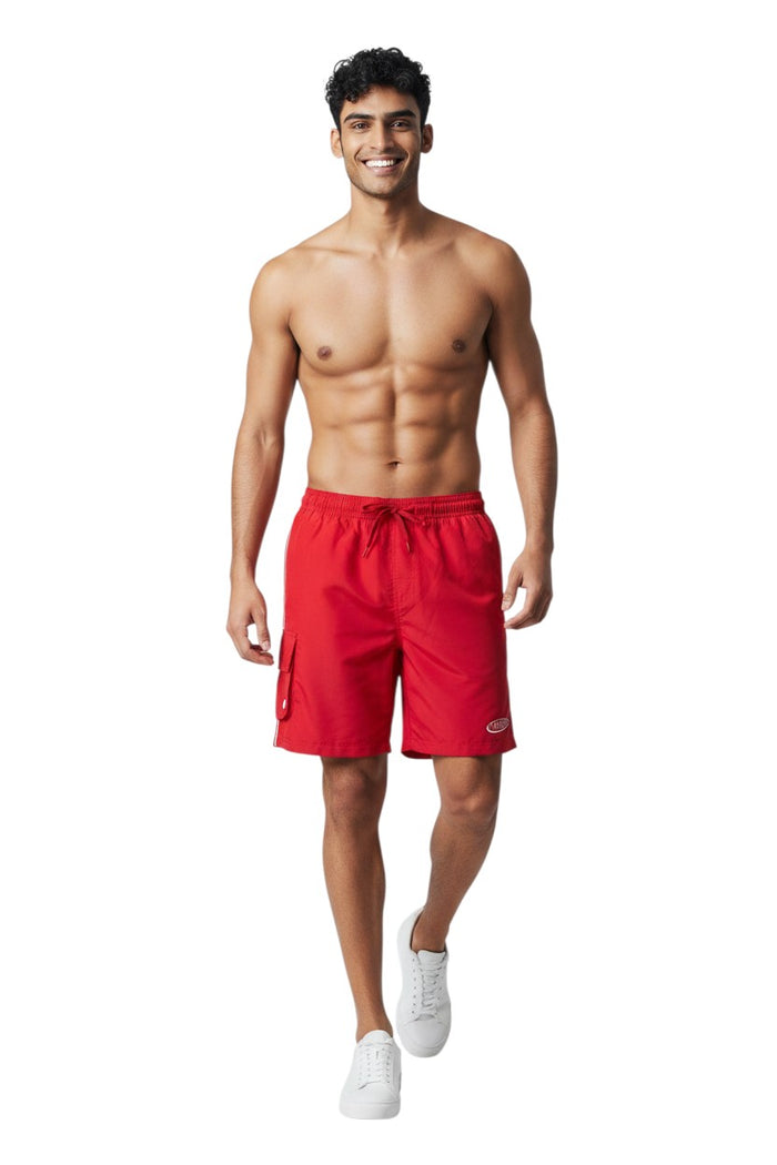 The Lifeguard Store red polyester board shorts with elastic waistband, drawstring, cargo pocket, and manager logo.