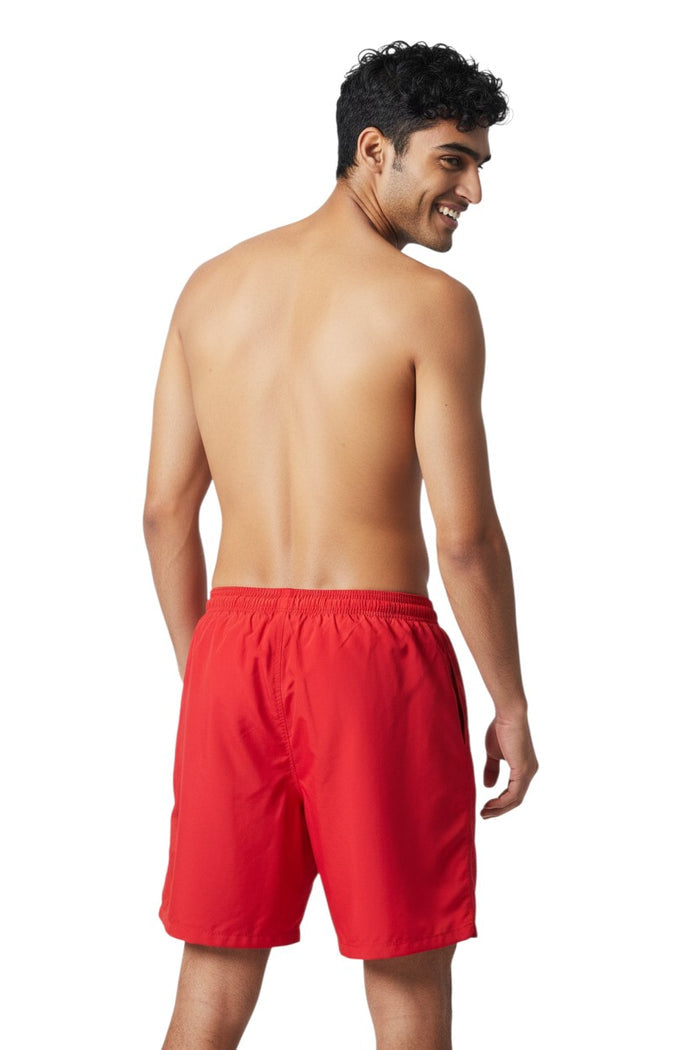 The Lifeguard Store red polyester board shorts with elastic waistband and 7" inseam. Ideal for beach or pool.