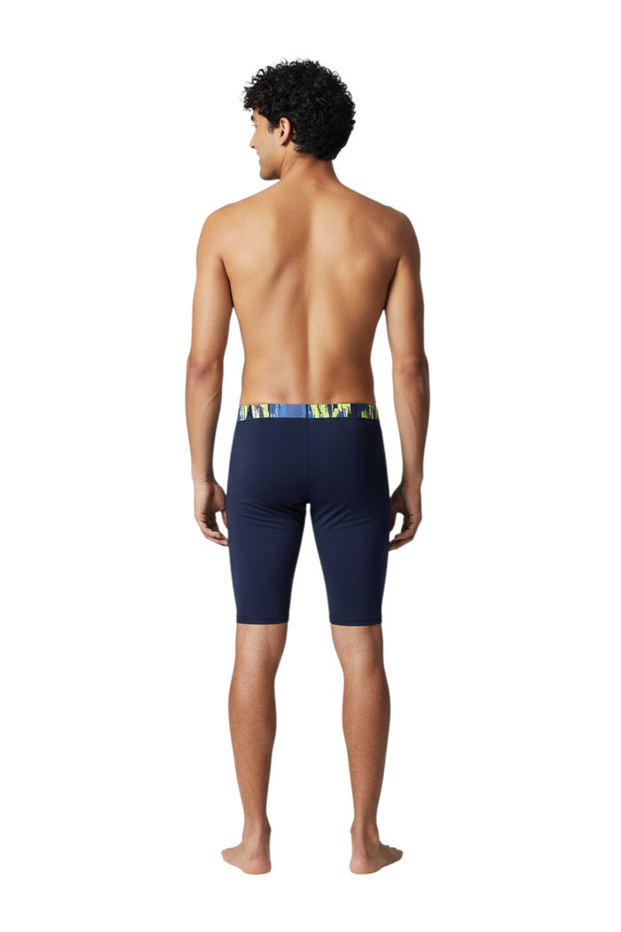 The Lifeguard Store navy blue polyester-spandex jammer swimsuit with a colorful abstract waistband and flat-locked seams.