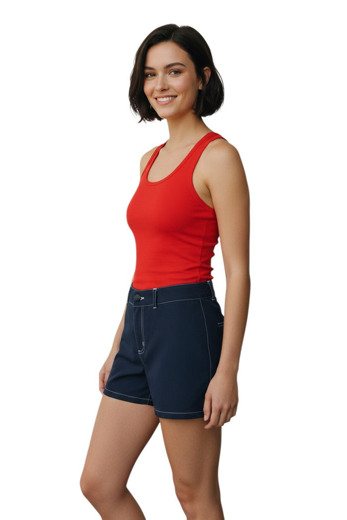 The Lifeguard Store RISE Solid Female Flex Short in navy blue polyester-spandex with white contrast stitching and a 5" inseam.
