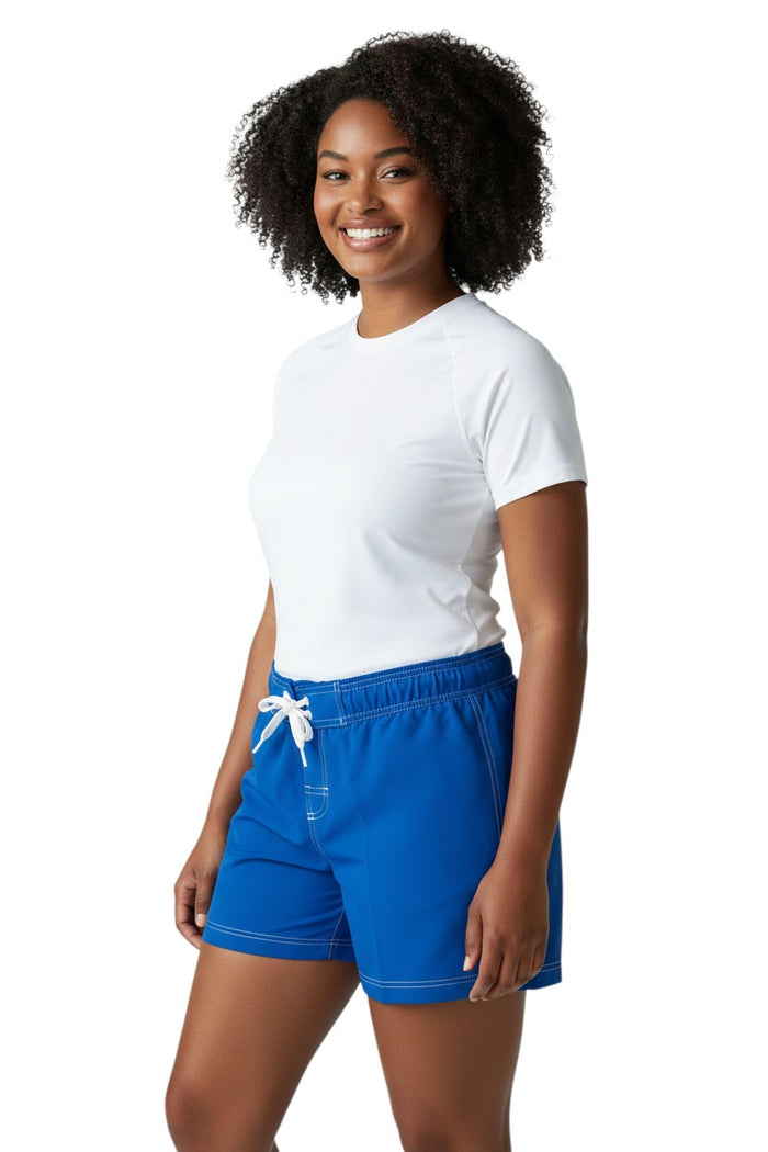 The Lifeguard Store RISE Solid Female Flex Short in royal blue polyester with white contrast stitching, drawstring waist, and side pocket.