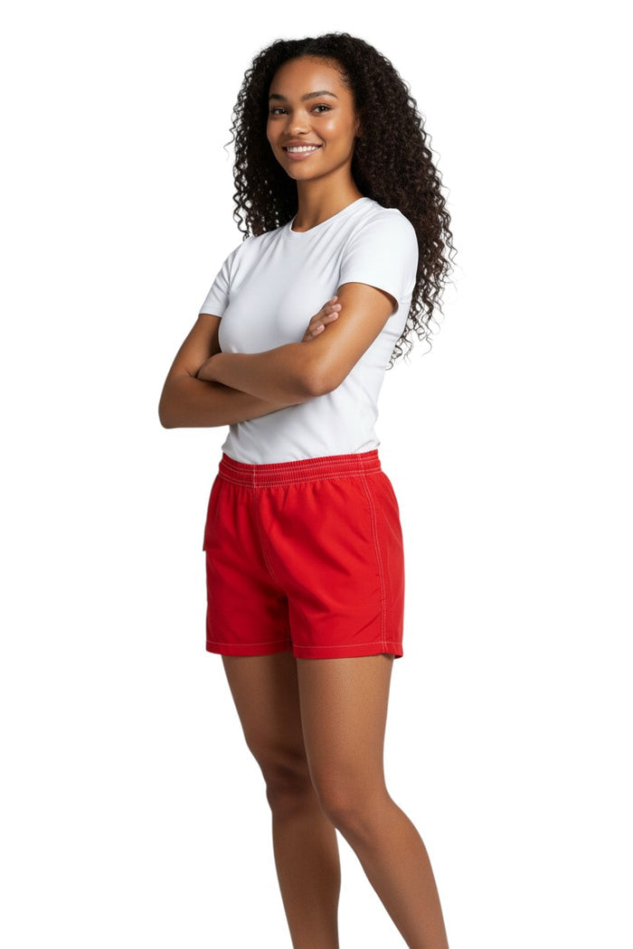 The Lifeguard Store red polyester-spandex board shorts with elastic waistband and side pocket.